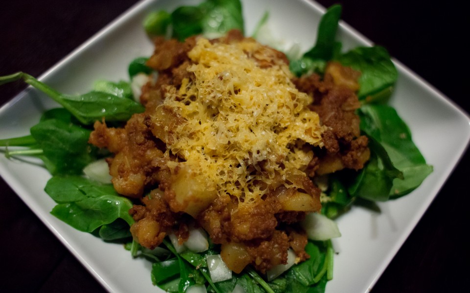 Chorizo Potato Smash Over Spinach Salad